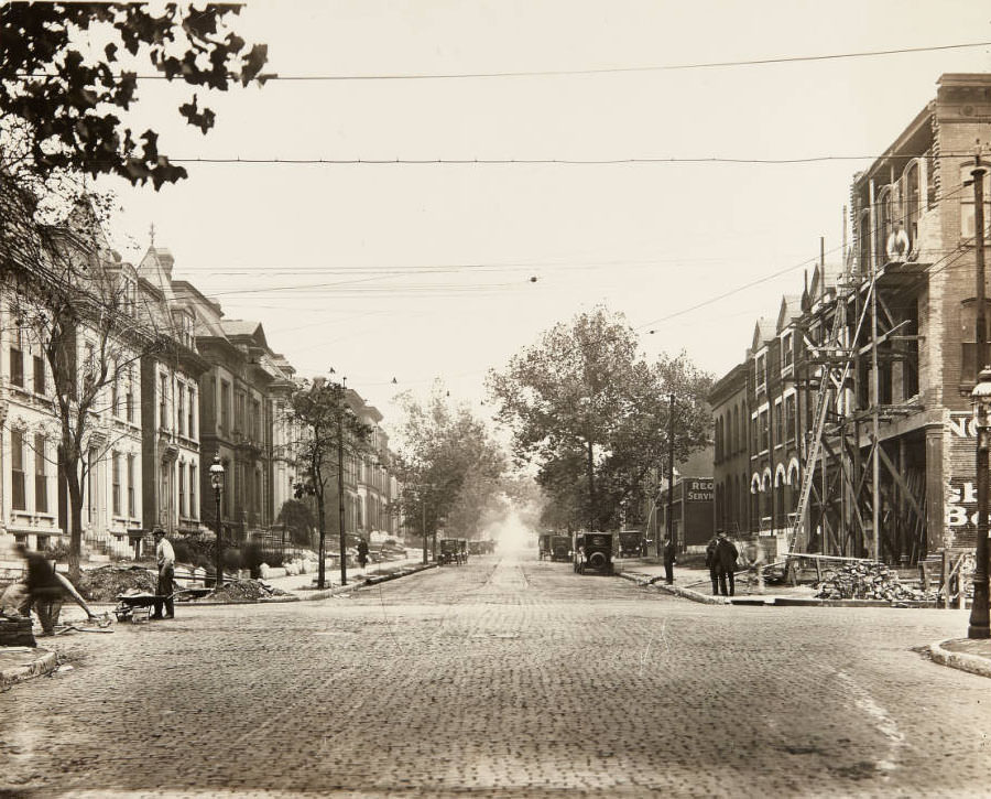 #86 Street and building repair work being done on Washington, just east of its intersection with Channing Avenue in Midtown, 1915