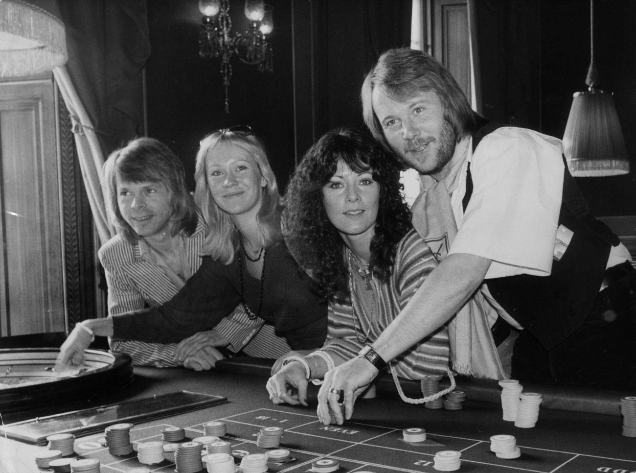 #14 ABBA try their luck at a Crockford’s roulette table whilst attending the premiere of their latest film ‘ABBA – The Movie’ in London.