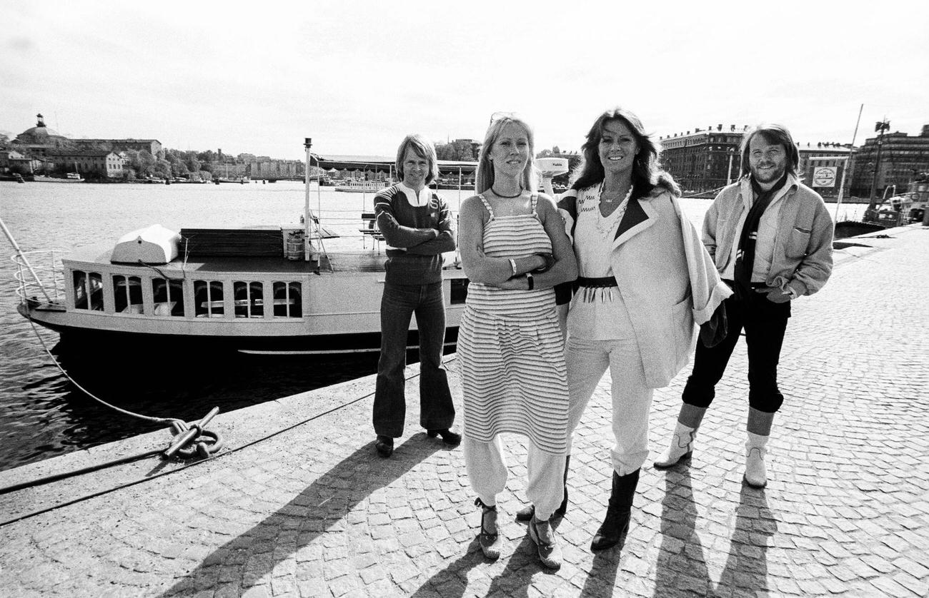 #16 ABBA group posing dockside, in Gamla Stan (Old Town), Stockholm, Sweden, July 1977.