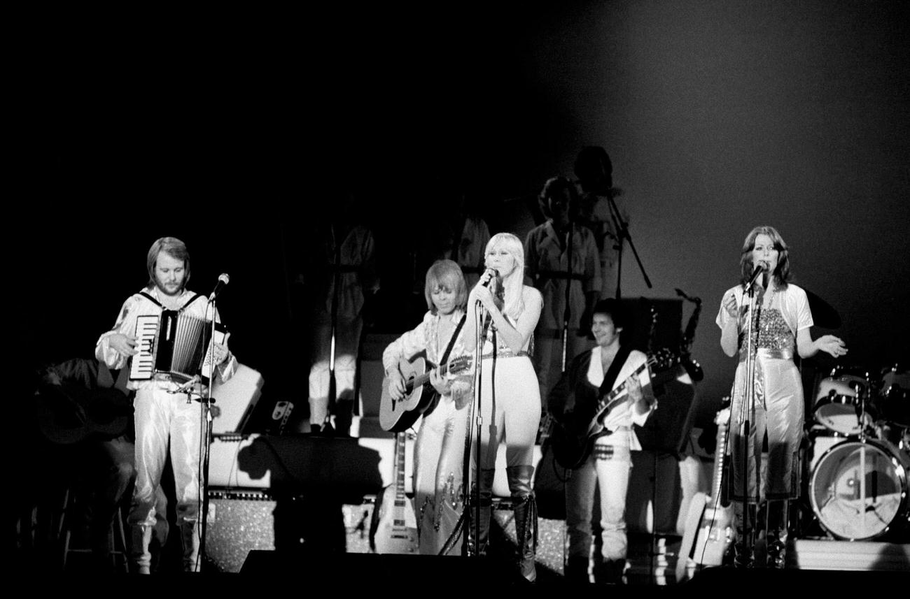 #18 Benny Andersson, Bjorn Ulvaeus, Agnetha Faltskog and Anni-Frid Lyngstad performing on stage at the Brondbyhallen on January 31,1977 in Copenhagen, Denmark