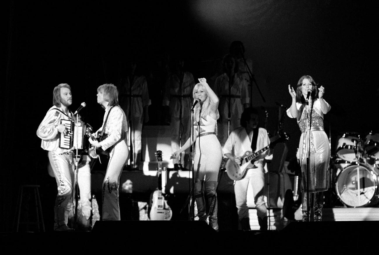 #20 Benny Andersson, Bjorn Ulvaeus, Agnetha Faltskog and Anni-Frid Lyngstad on stage at the Brondbyhallen on January 31,1977 in Copenhagen, Denmark.