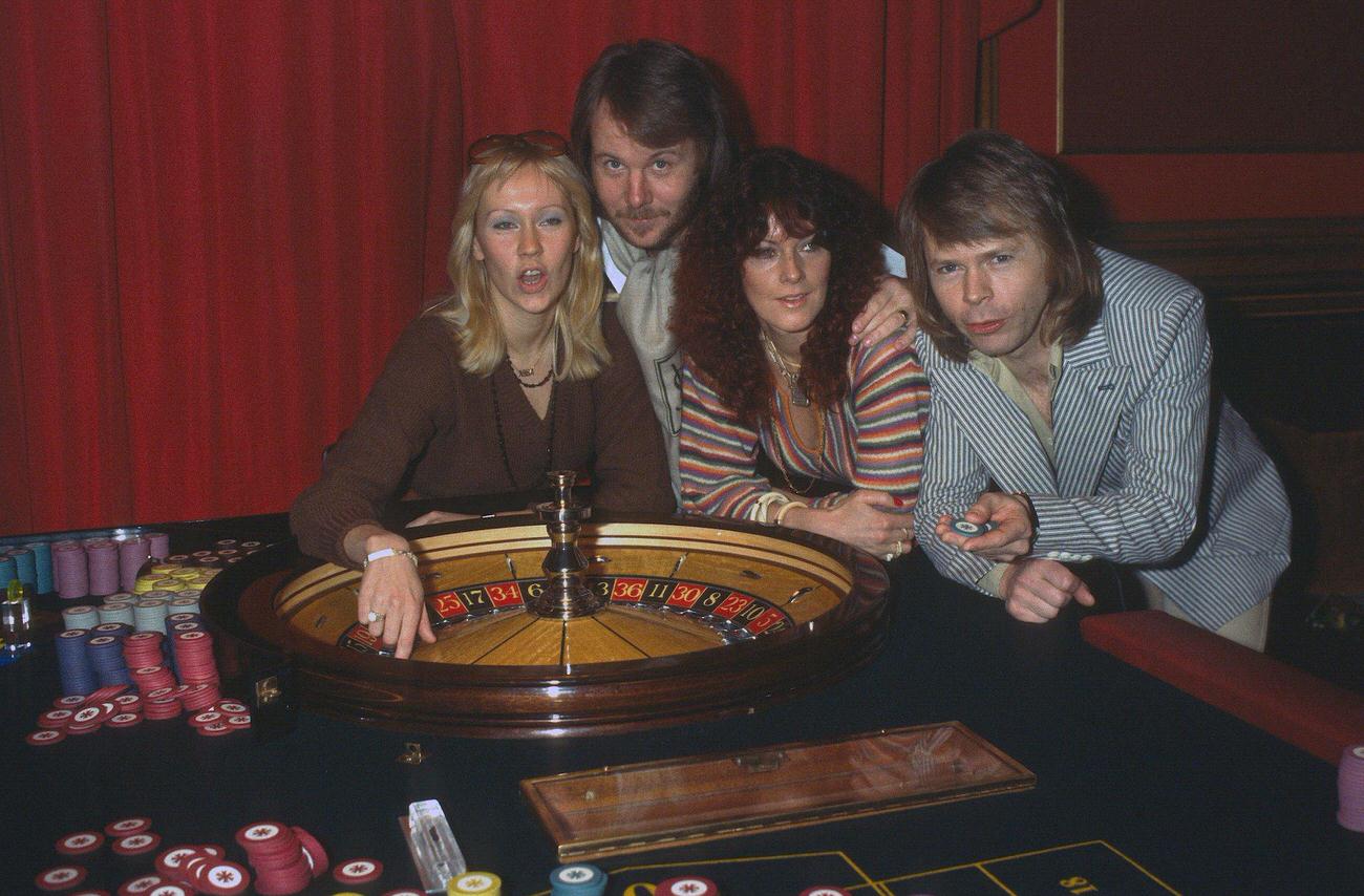 #61 Abba (L-R) Agnetha Faltskog, Benny Andersson, Anni-Frid Lyngstad and Bjorn Ulvaeus, play roulette during a visit to London, 1974