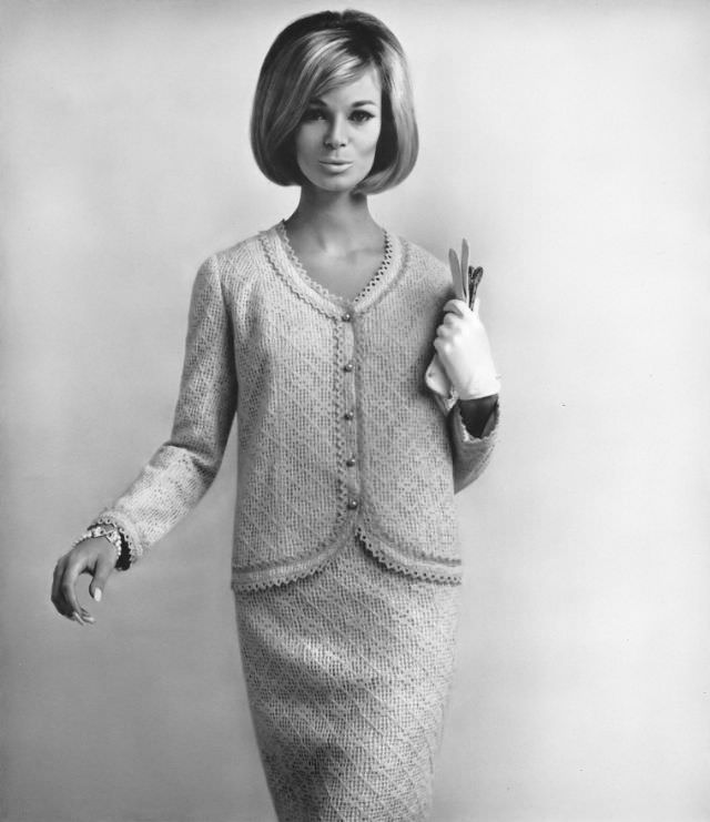 #28 Anne de Zogheb in light and lacy knit suit edged all around in crocheting by Ricano, Vogue, December 1, 1964