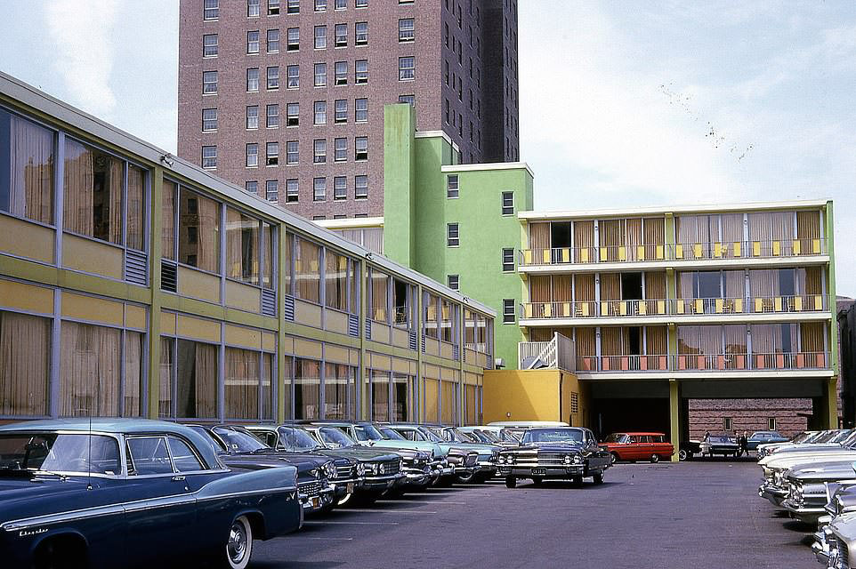 #51 A glamorous array of large cars in the parking lot of the Colony Motel in 1962