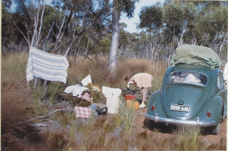 #20 Betty and a morning wash-after cleaning the oil filter, Western Australia, May 6, 1963