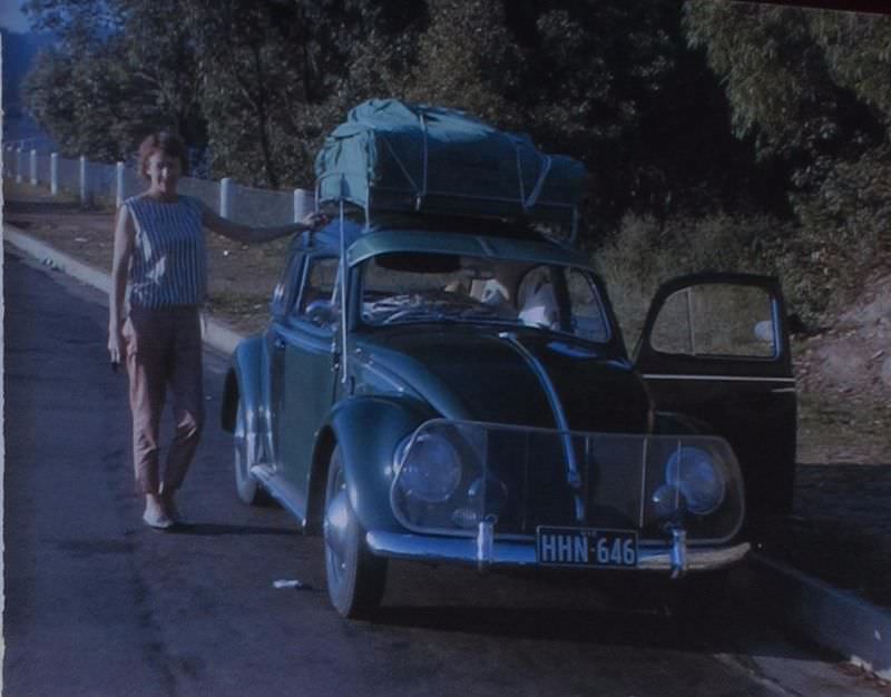 #40 Betty beside VW, 1963