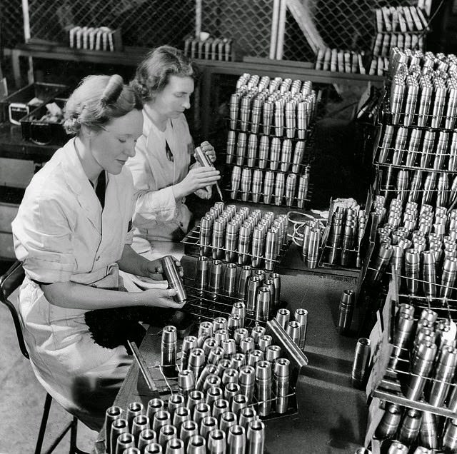 #10 Two women inspecting empty anti-aircraft shell cases before they are filled in a munitiions factory in South Australia.