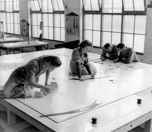 #12 Two young women drawing plans of Beaufort bomber with two military men study plans.