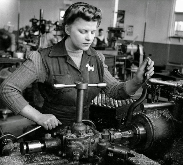 #15 A young woman making brass fittings for military tanks.