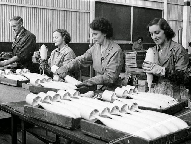 #21 Inspecting RAAF practice bombs before removal to an explosives filling factory in South Australia.