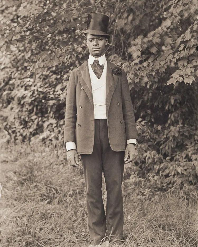 #29 Isaac (Ike) Perkins Wearing a Top Hat. Ike Perkins was a member of the Improved Benevolent Order of Elks of the World and posed for Bullard informal wear, worn by Elks for special ceremonies.