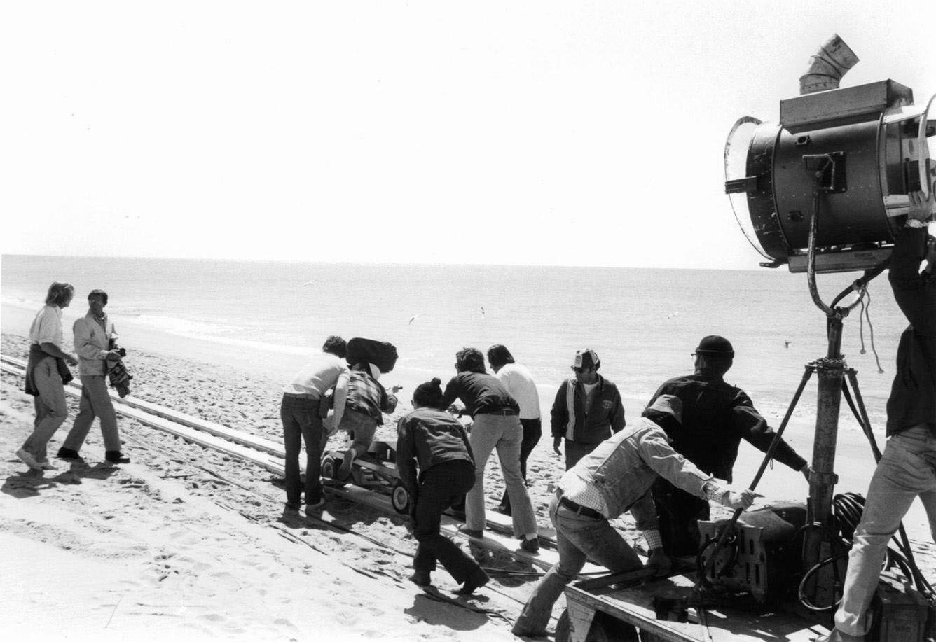Roy Scheider (2nd left) on beach as crew films in a scene from ‘Jaws’, 1975.