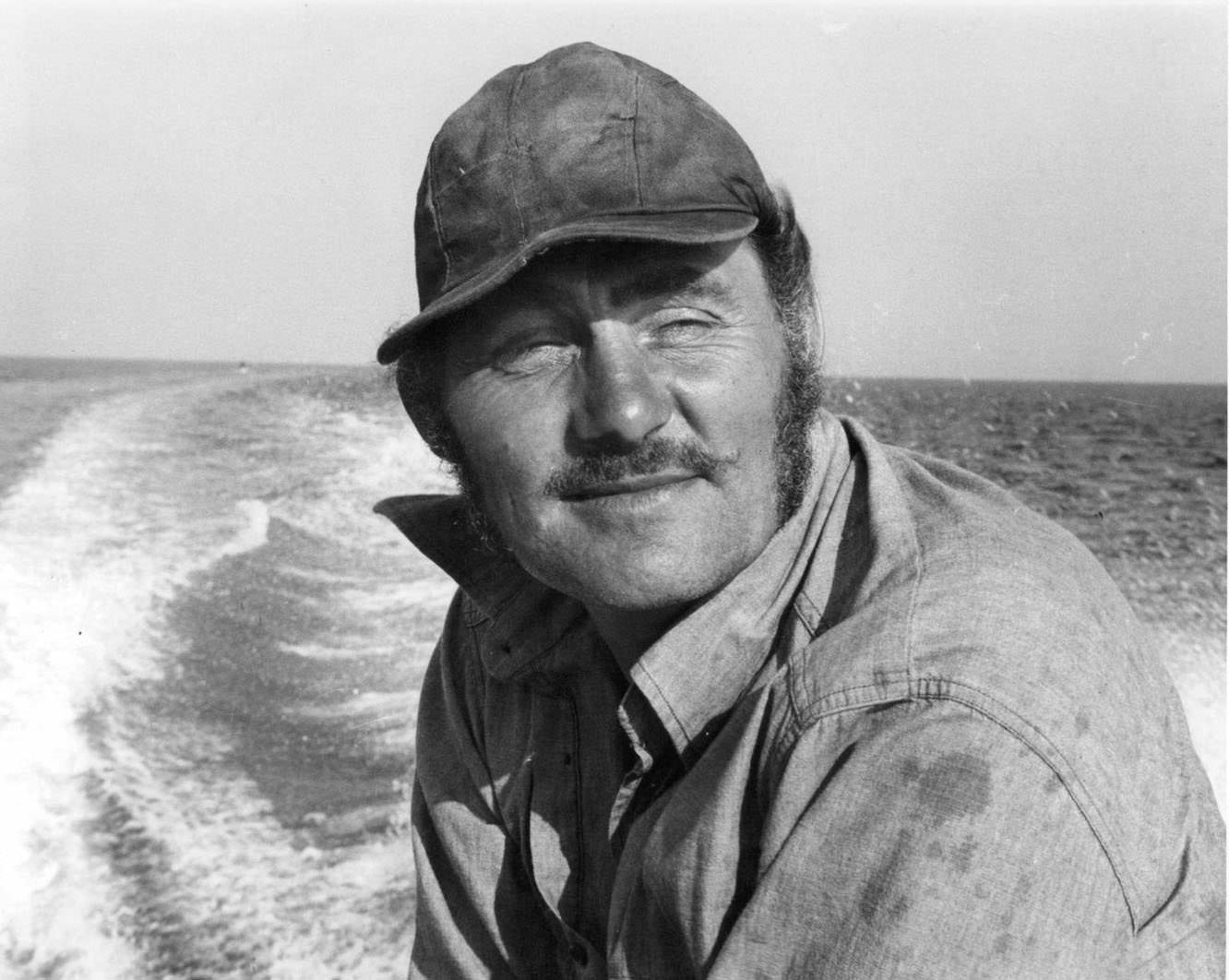 Robert Shaw stands around netting in a scene from the film ‘Jaws’, 1975.