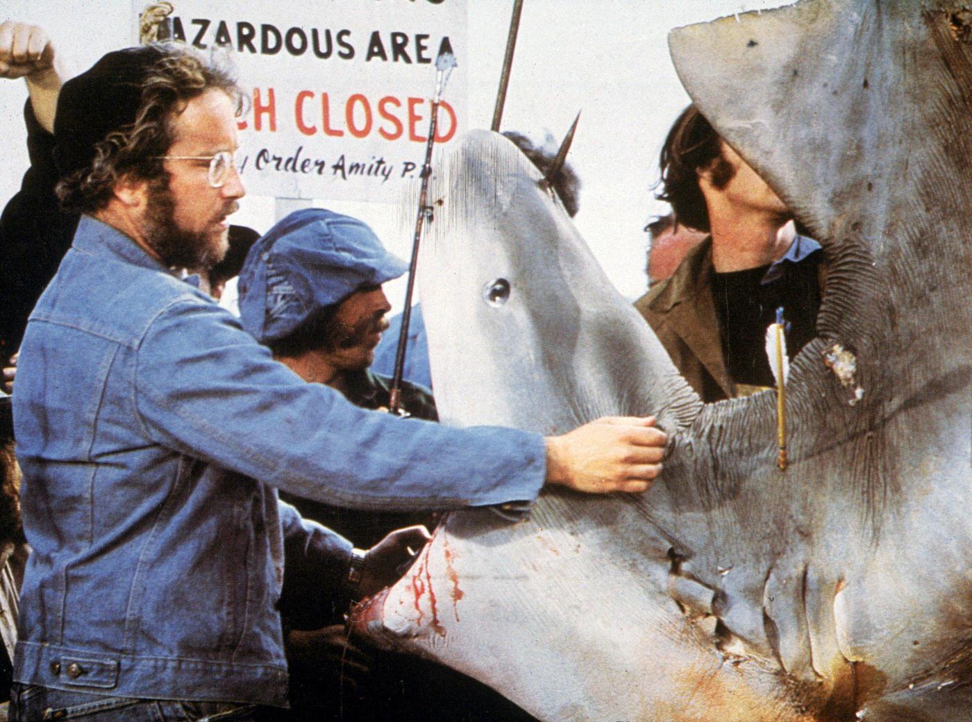 American actor Richard Dreyfuss inspects the mouth of a dead Great White shark in a still from director Steven Spielberg’s film, ‘Jaws,’ 1975.