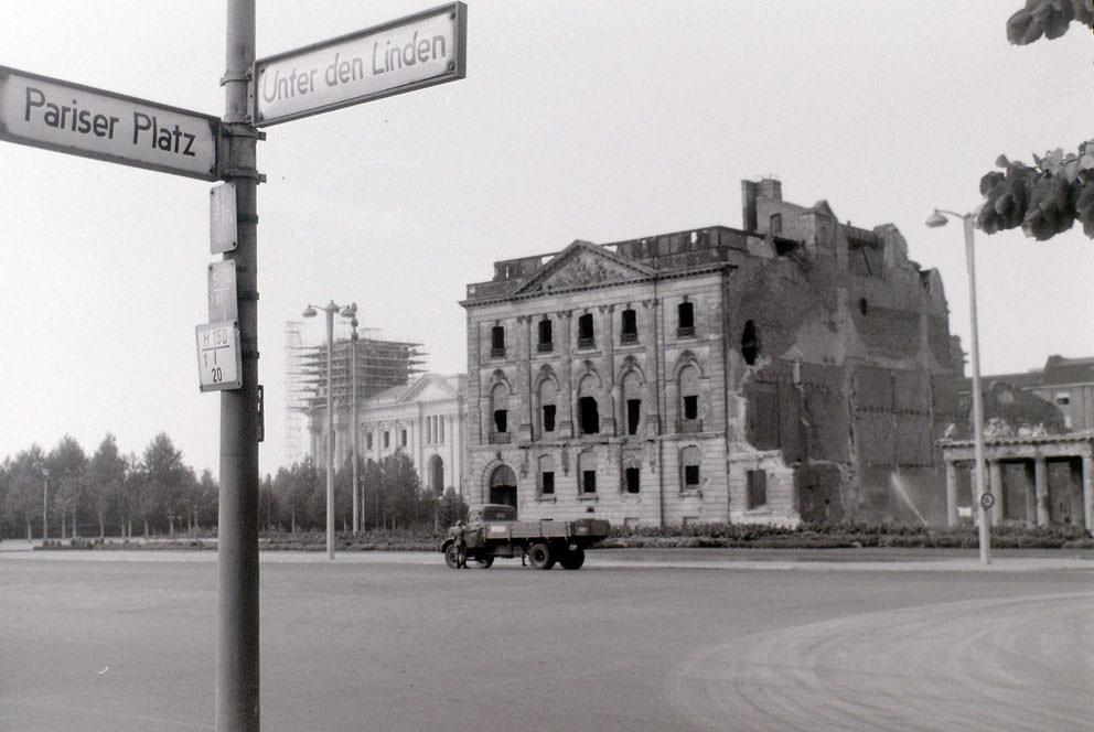 #56 The bombed building was on the north side of Unter den Linden in East Berlin, very near the Brandenburger Tor, with the Reichstag beyond it being in West Berlin.