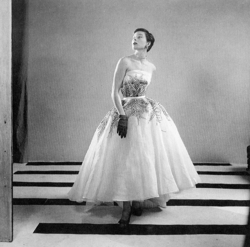#67 Bettina in Fath’s organdy evening dress with fern embroidery by Lesage, 1950