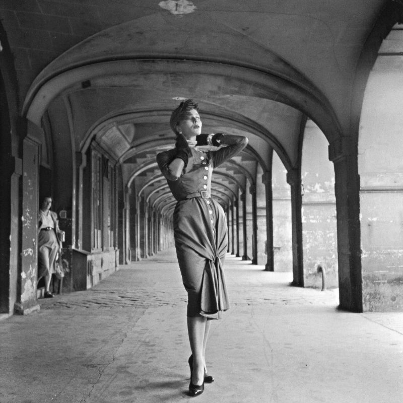 #70 Bettina in day dress by Jacques Fath, Place des Vosges, Paris, 1950