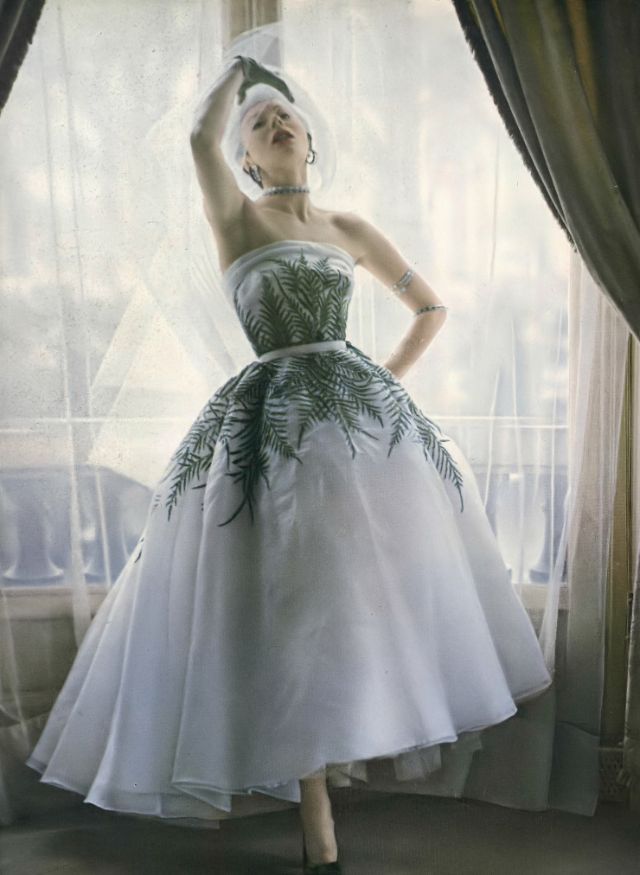 #72 Bettina in gorgeous organdy dress embroidered with delicate traceries of ferns and sequins by Jacques Fath, 1950
