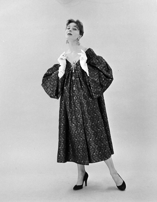 #93 Bettina in Givenchy’s smock-style off-shoulder dress, February 1952