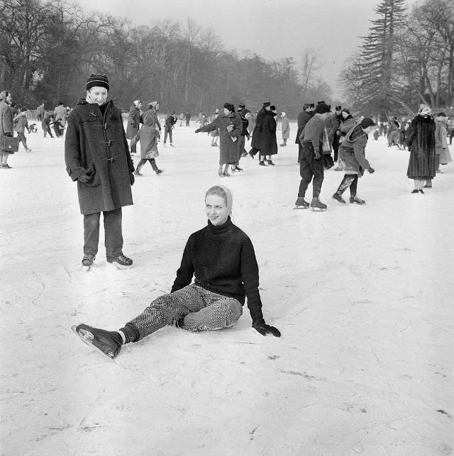 #8 Tessa Beaumont, dancer from Les Ballets Roland Petit, sitting on the ice.