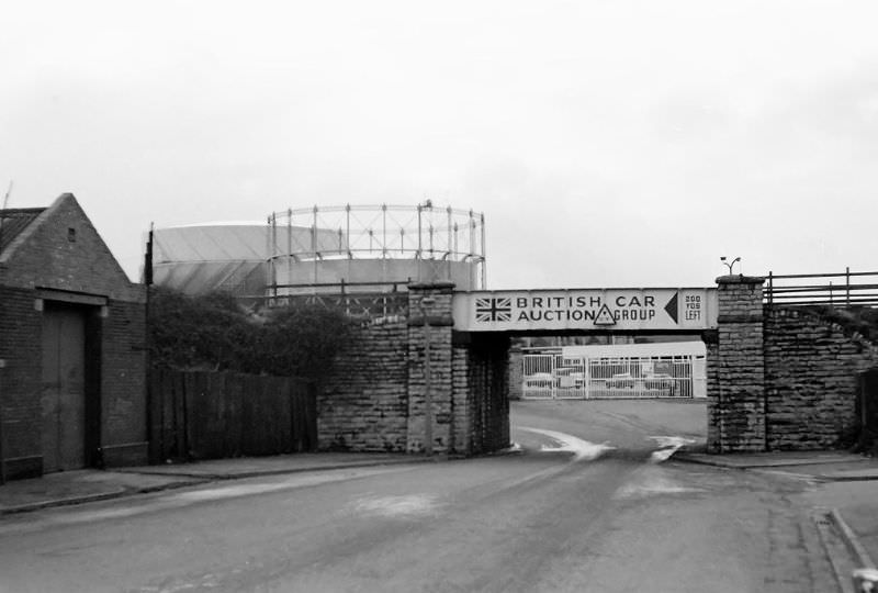 #9 Looking west in Grangetown. This was the bridge that took the freight line down to the old oil terminal by the river Ely. The bridge has gone now and the view ahead dominated by IKEA, Cardiff, December 1974