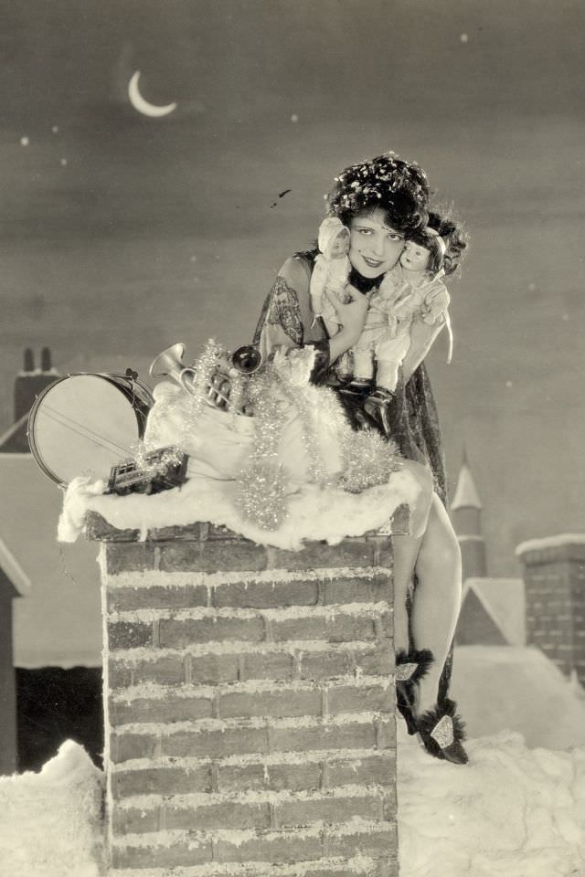 #80 Clara Bow poses for a Christmas promotional photo in 1920.