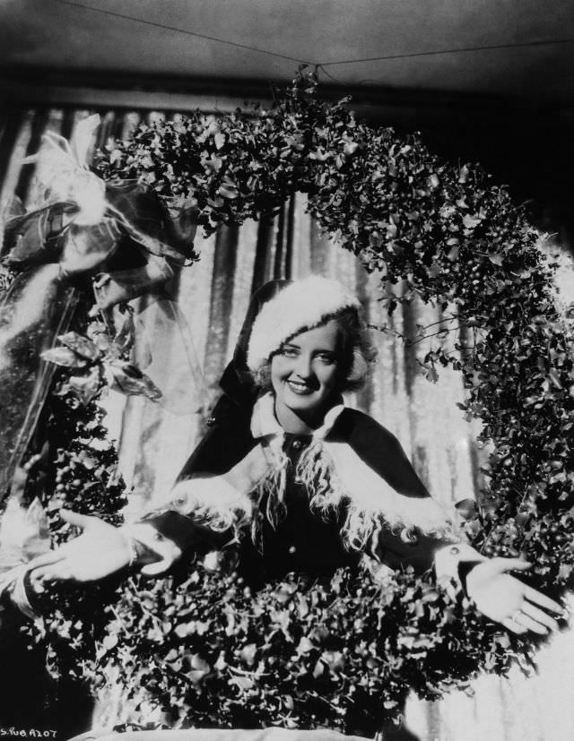 #30 Bette Davis dressed up as Santa Claus, 1930.