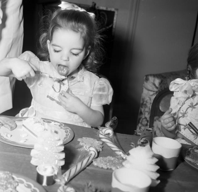 #34 Little Liza Minnelli chowing down on ice cream and candy, 1948.
