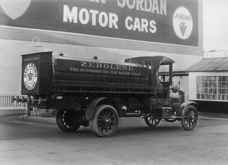 Standard Oil Company Red Crown Gasoline and “Zerolene” Federal brand refueling truck parked at a San Francisco Standard Oil Co. gas station. Large billboard in the background advertising “Jordan Motor Cars”, 1918