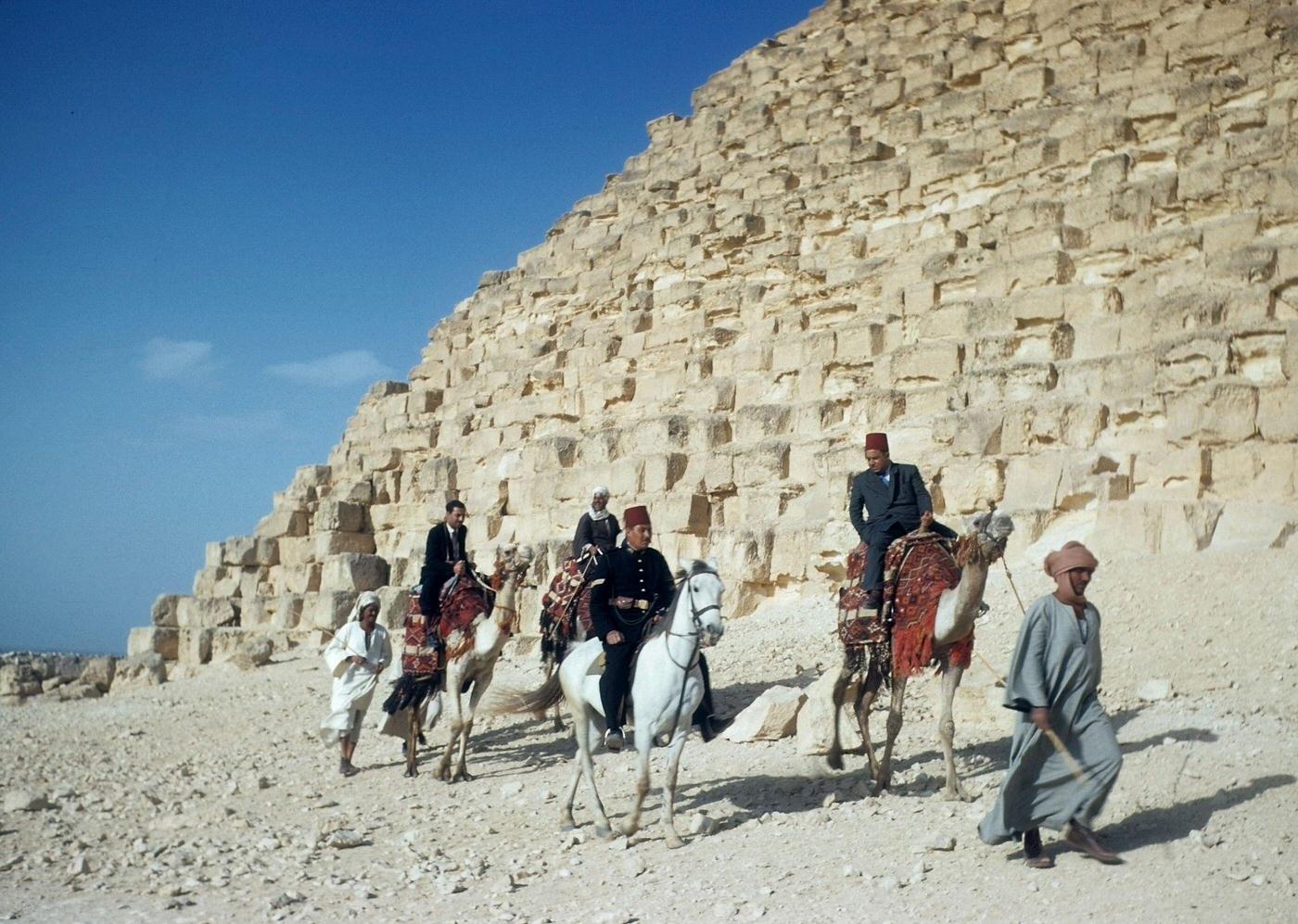 #4 A group of men are lead by camel past the Great Pyramid of Giza (Pyramid of Khufu) in Giza, Egypt, 1940s