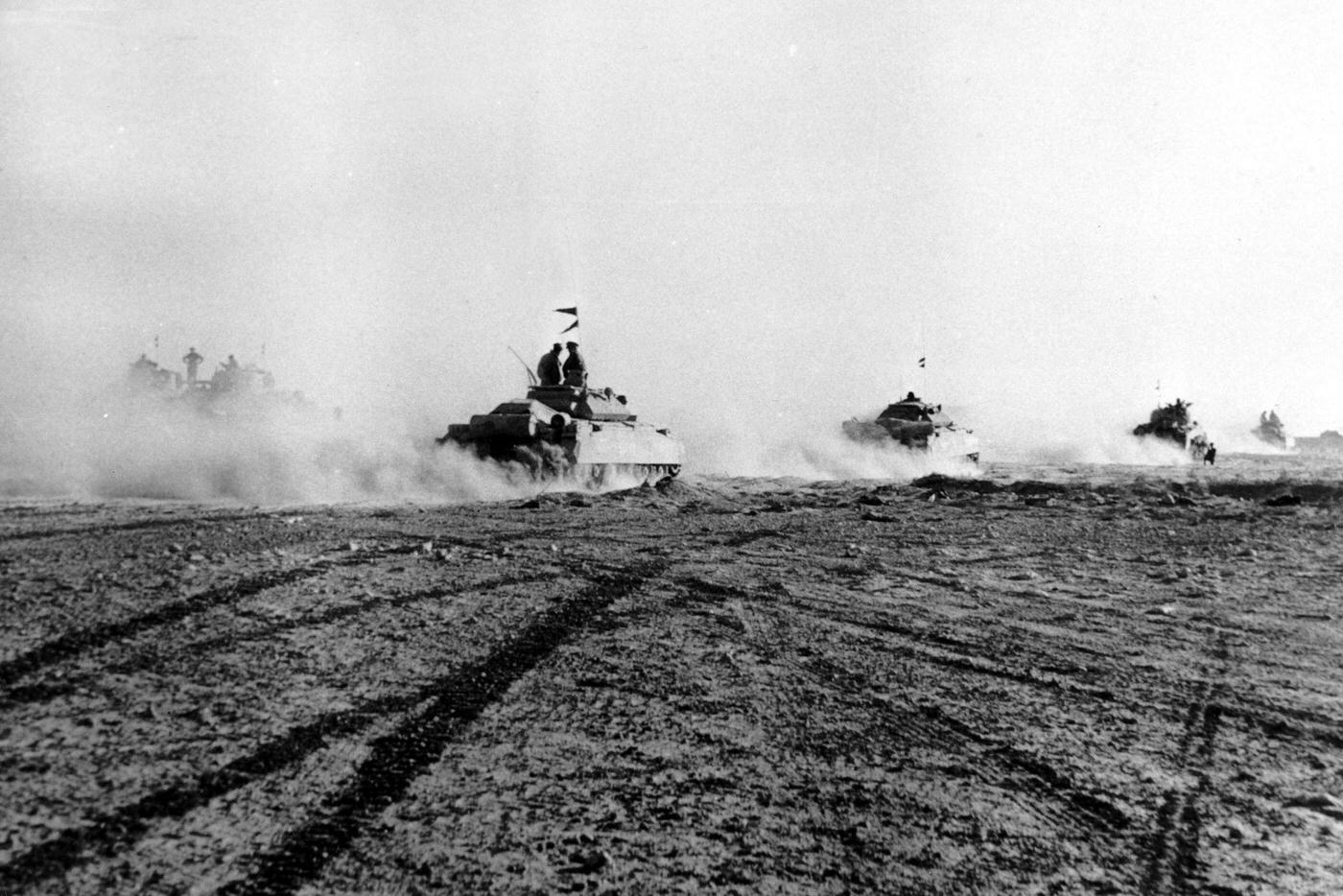 #20 British tanks advancing in the desert during the battle of El Alamein, 1942