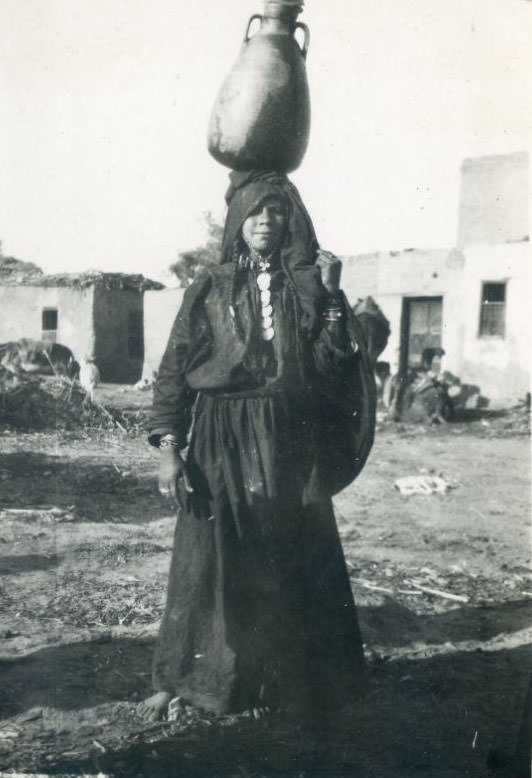 #63 Native woman carrying water, Egypt
