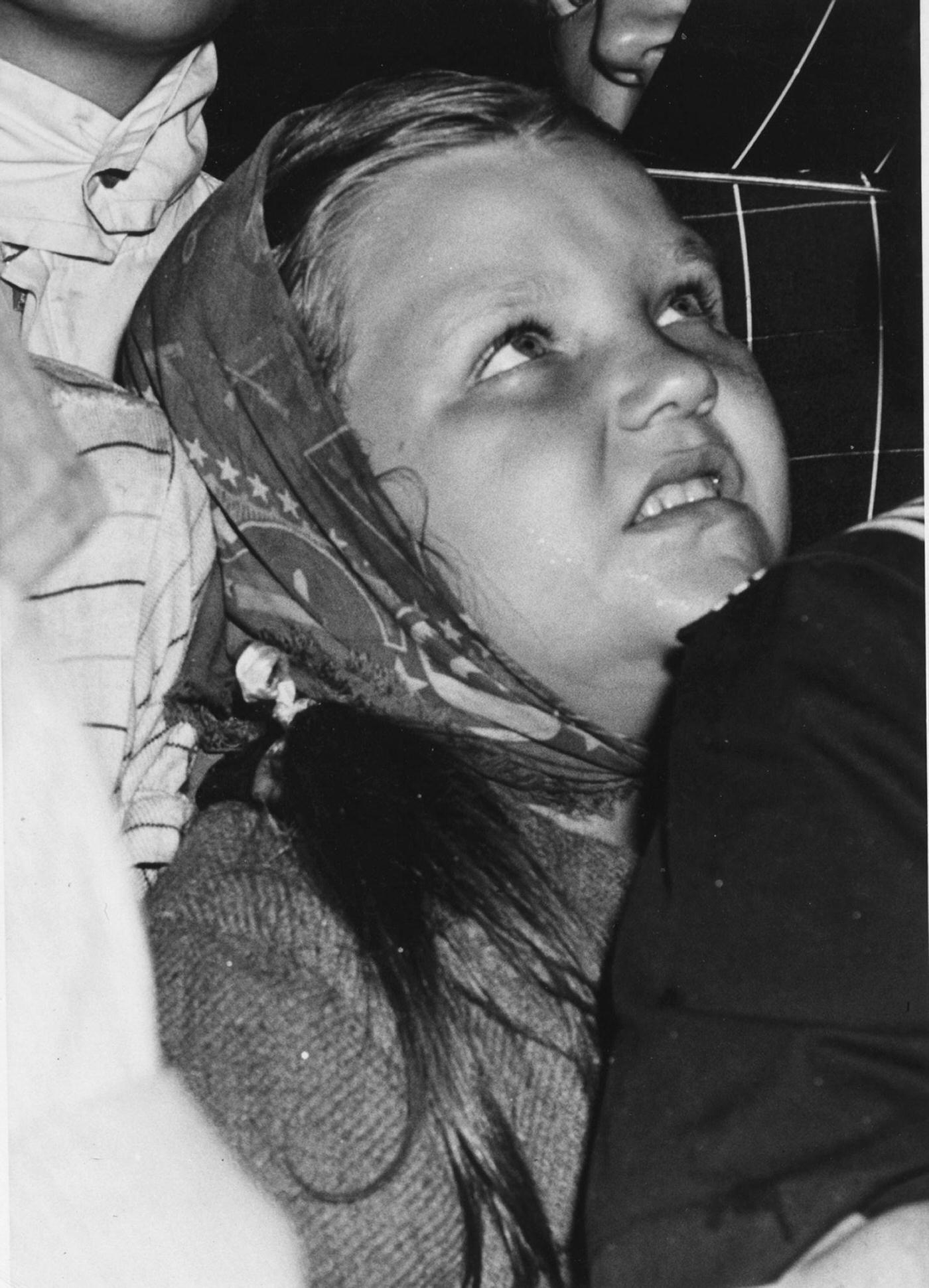 #22 A girl as she looks up at the Empire State Building