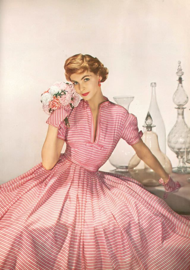 #2 Georgia Hamilton in dress of white and pink striped silk by Mollie Parnis, Harper’s Bazaar, April 1952