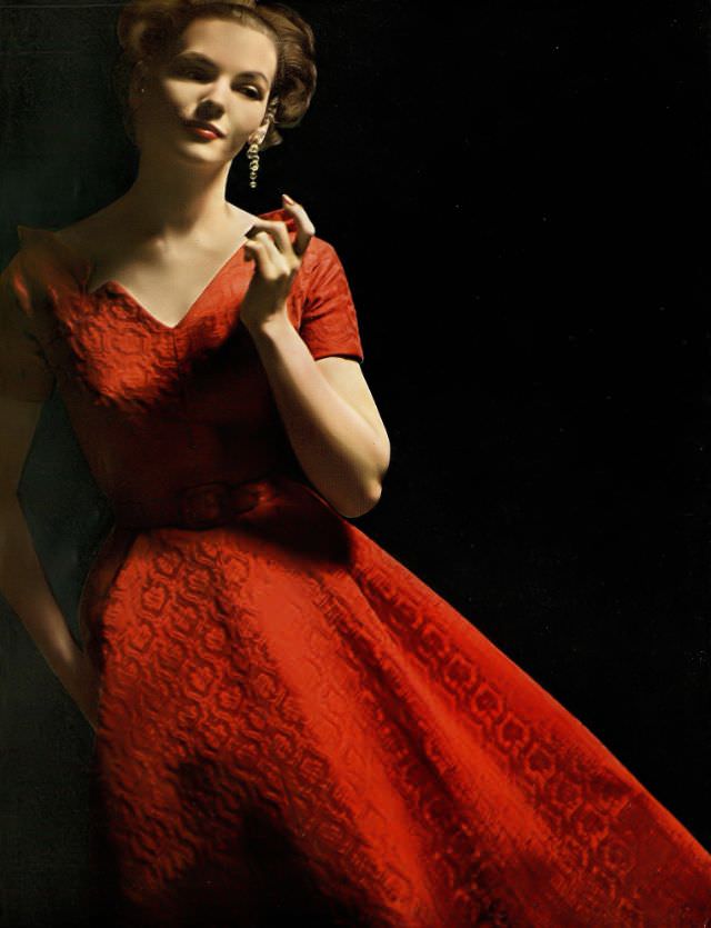 #6 Georgia Hamilton in red damask evening dress by Richard Cole for Carolyn Modes, crystal drop earrings by Mosell, August 1953