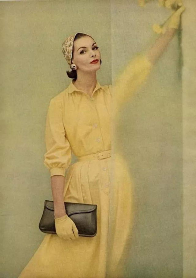 #31 Georgia Hamilton wearing a yellow cotton shirtdress, 1955