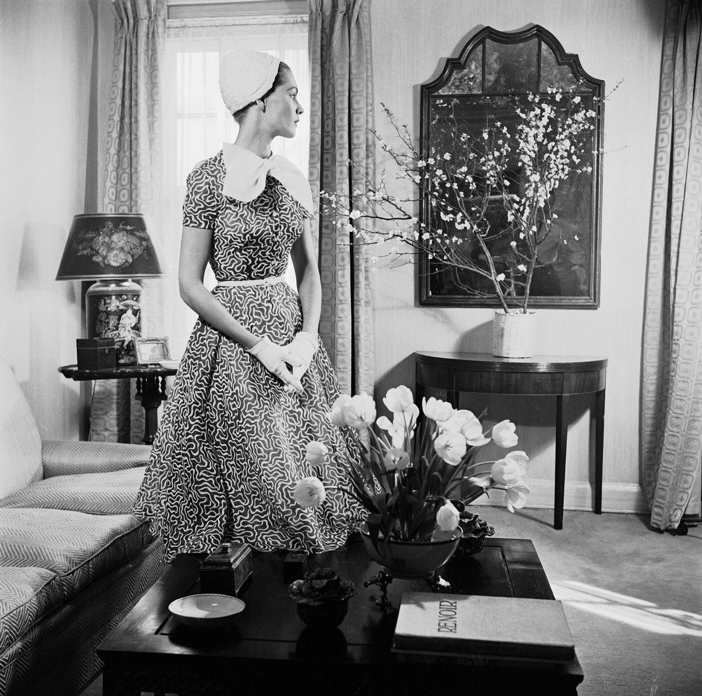 #36 Georgia Hamilton models a slate gray and white day dress by Carolyn Modes.