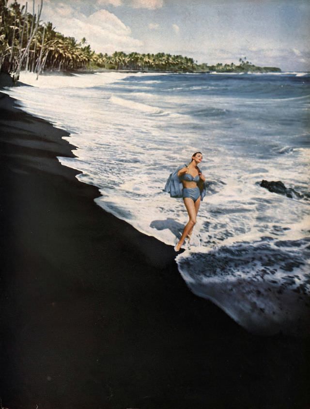 #19 Carmen Dell’Orefice in cotton two-piece bathing suit by Cole of California, matching cover-up by Leon Levine, photo by Gleb Derujinsky, Hawaii, Harper’s Bazaar, January 1959