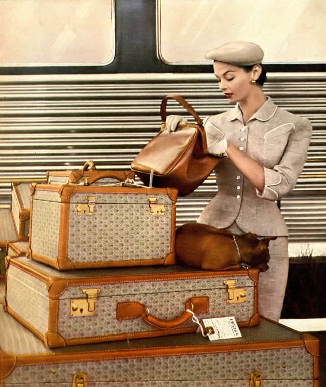 #2 Eva Gerney in suit of Forstmann wool mixed with silver thread by Branell, beret by John-Frederics, llama calf bag by Coblentz, Wings Heirloom luggage, photo by Gleb Derulinsky, Harper’s Bazaar, December 1953