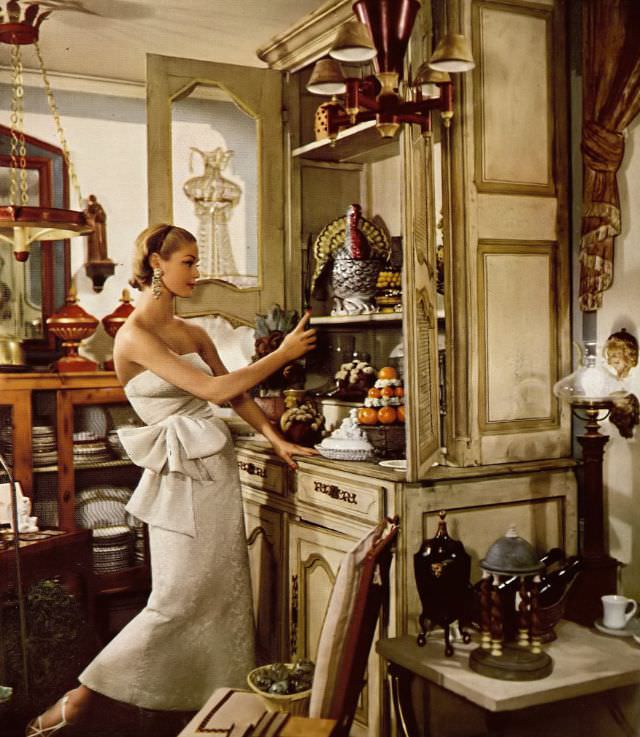 #3 Jean Patchett in strapless top wrapped with a sash and a slim skirt with two pleats in back, photo by Gleb Derujinsky, Harper’s Bazaar, July 1954