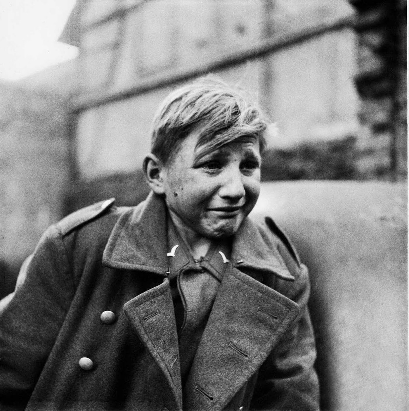 #1 A sixteen-year-old German soldier, Hans-Georg Henke, cries being captured by the US 9th Army in Germany on April 3, 1945