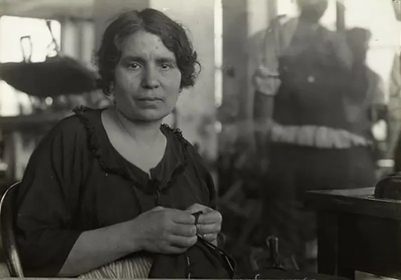 #17 Italian clothing worker in Rochester, NY factory, 1915.