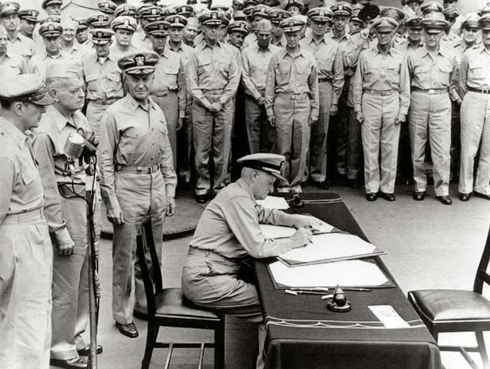 #13 FAdm. Nimitz signs Japanese Surrender Instrument.