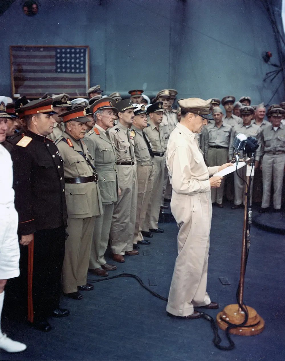 #19 MacArthur at surrender ceremony. The flag flown by Perry is visible in the background.