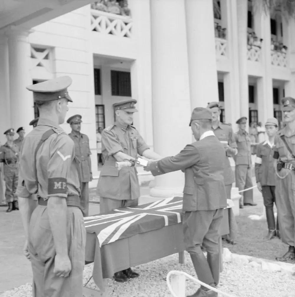 #26 The surrender ceremony of the Japanese to the British forces with General Itagaki surrendering his sword to General Frank Messervy at Kuala Lumpur, British Malaya, on 22 February 1946.