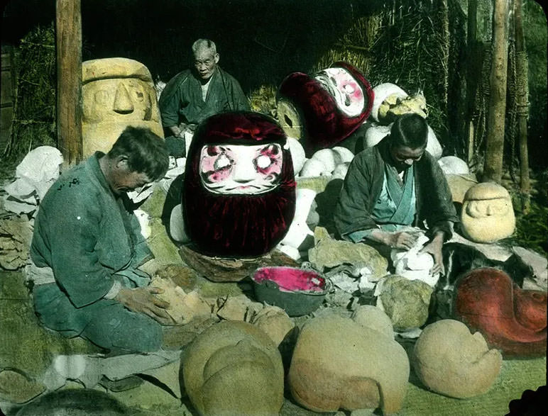 #14 Men making clay moulds for giant masks.