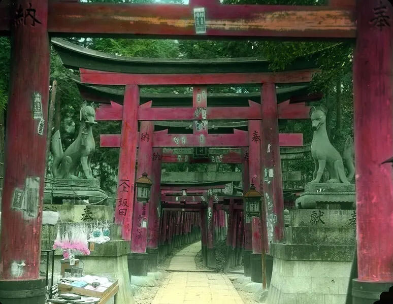 #26 Series of red wooden gateways; stone animals on pedestals between first and second gateway.