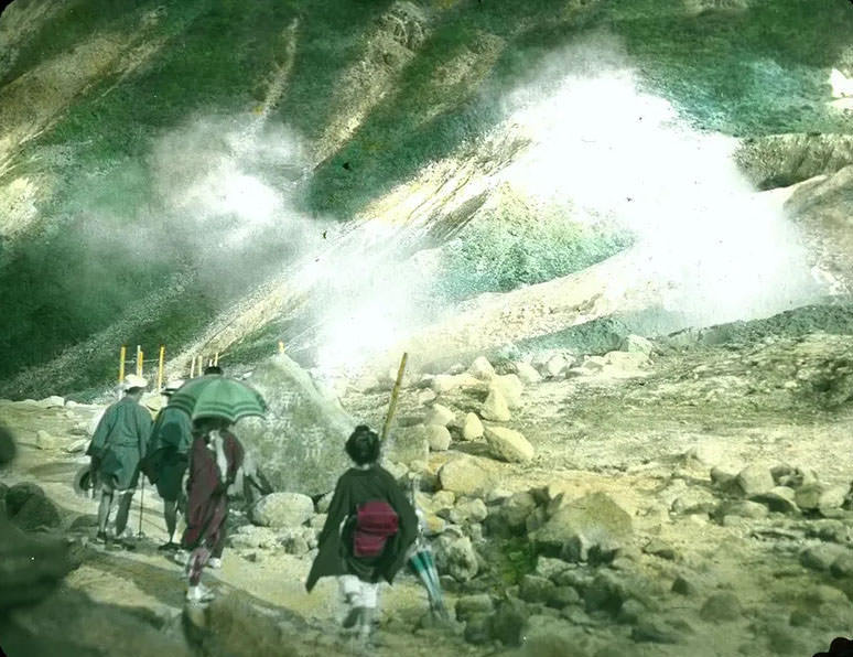 #3 Japanese people in local attire hiking through mountains.