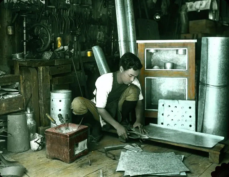 #31 Tinsmith at work.