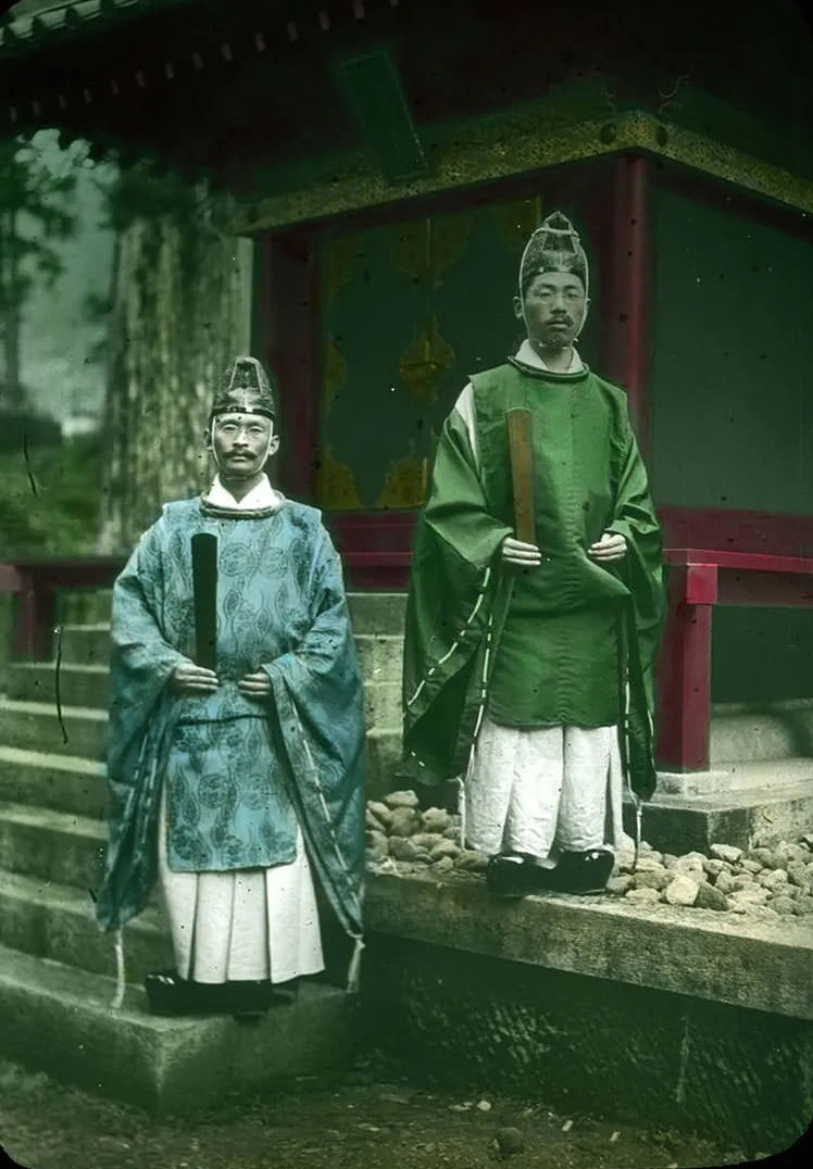 #32 Two (priests ) outside shrine.